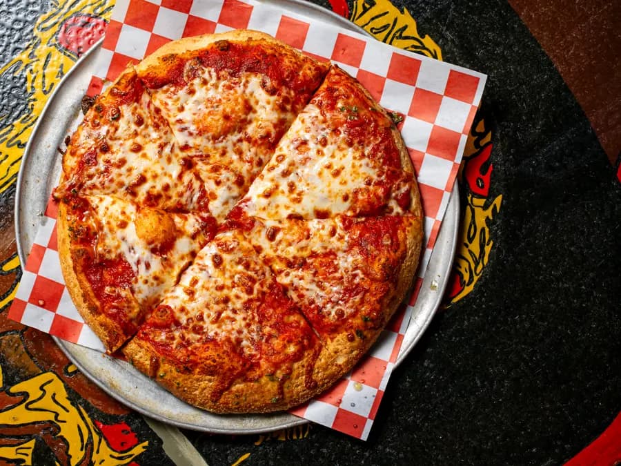 Cheese pizza with melted mozzarella on our sourdough crust