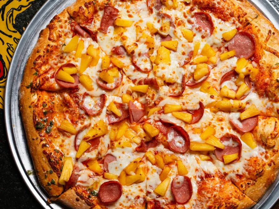 Hawaiian pizza with ham and pineapple